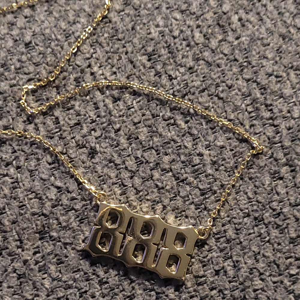Gold Colored Necklace with "888" Angel Number